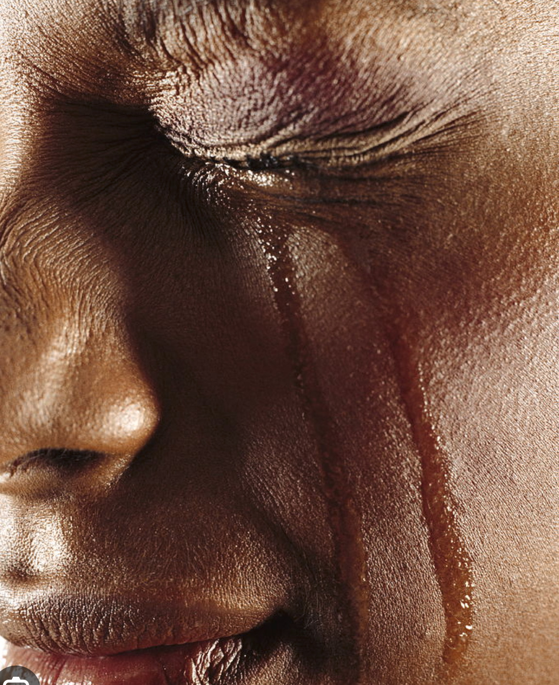 An african woman crying